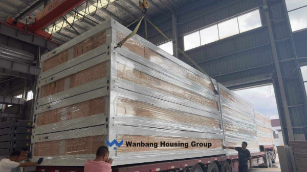 Flat-pack container houses loaded into a 40HQ container for export from China &mdash; Wanbang